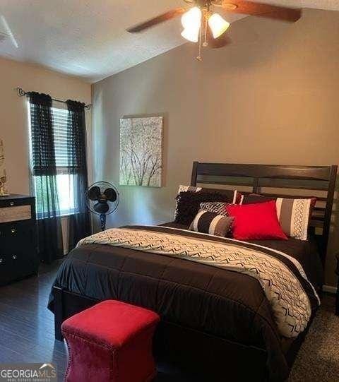 bedroom featuring hardwood / wood-style floors and ceiling fan