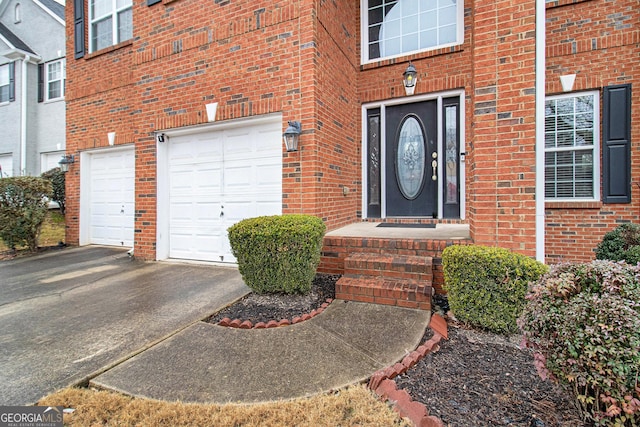 doorway to property featuring a garage