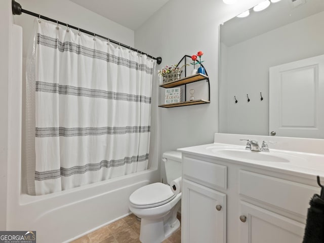 full bathroom with vanity, toilet, and shower / bath combo with shower curtain