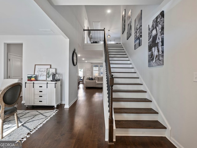 stairway featuring hardwood / wood-style flooring