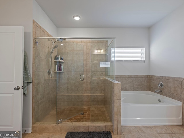 bathroom featuring shower with separate bathtub and tile patterned floors