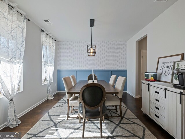 living room featuring dark wood-type flooring, ceiling fan, and a fireplace