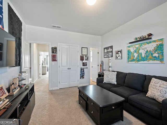 living room featuring light colored carpet