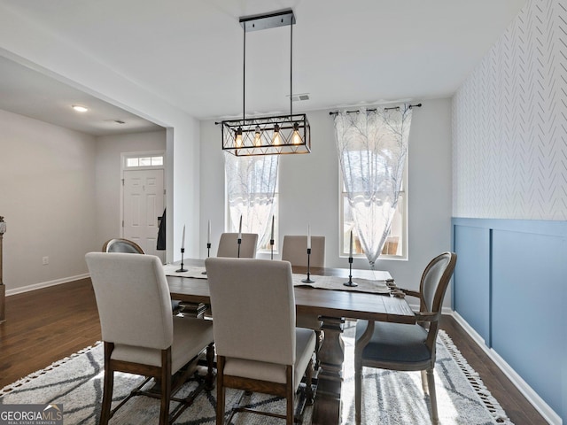 dining space featuring dark hardwood / wood-style flooring