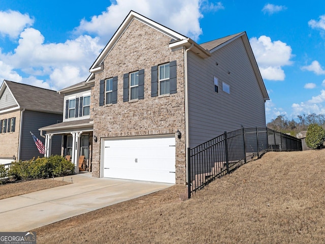 view of front facade featuring a garage and a front yard