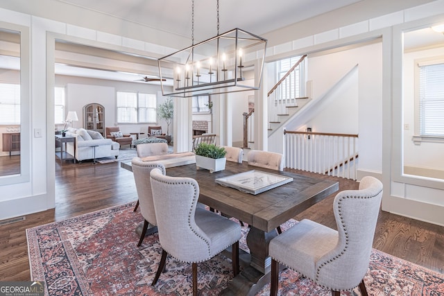 dining room featuring dark wood-type flooring and a chandelier