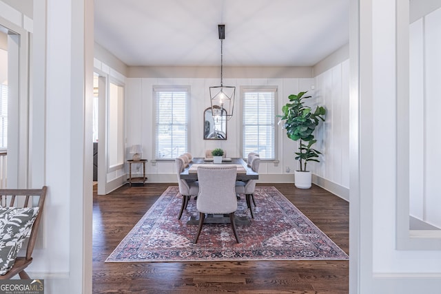 dining space with dark hardwood / wood-style floors