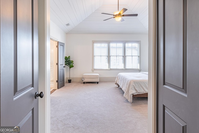 bedroom with ceiling fan, lofted ceiling, carpet flooring, and wooden ceiling