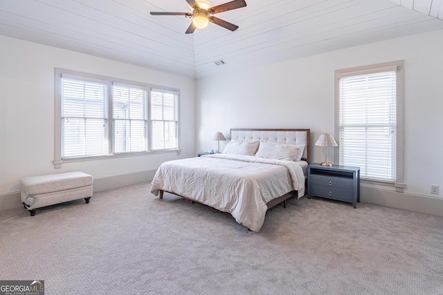 bedroom with multiple windows, wooden ceiling, and ceiling fan