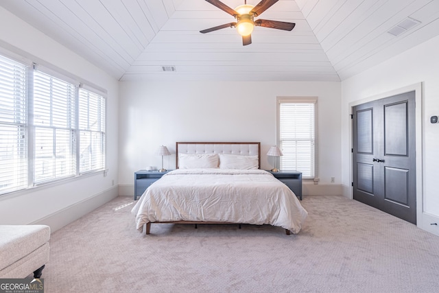 carpeted bedroom with ceiling fan, lofted ceiling, and wooden ceiling