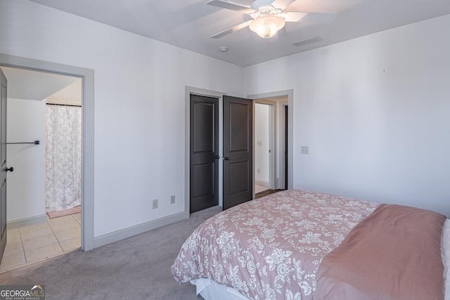 bedroom with ceiling fan and light colored carpet