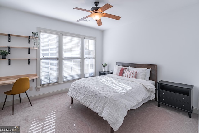 bedroom with light colored carpet and ceiling fan