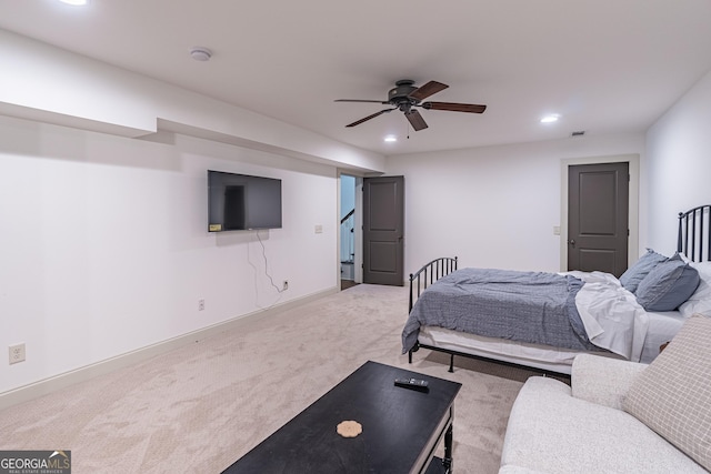 bedroom with light carpet and ceiling fan