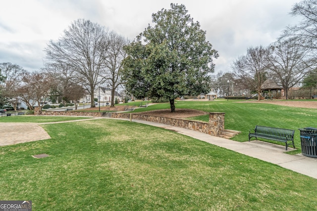 view of property's community with a lawn