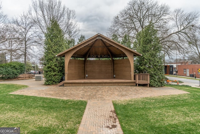 view of property's community with a gazebo and a lawn