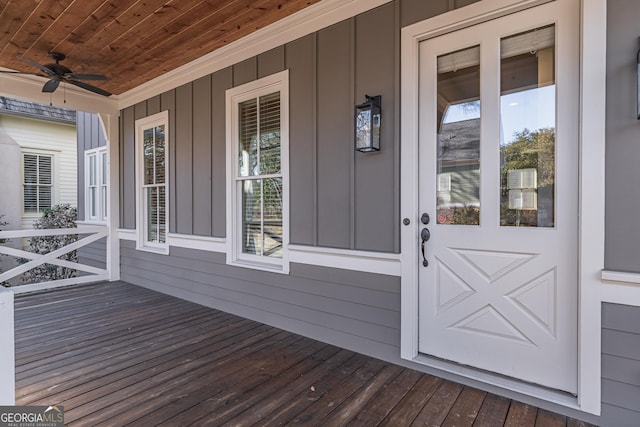 doorway to property featuring ceiling fan and a porch