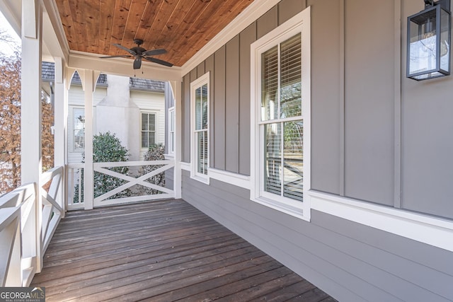 wooden deck featuring ceiling fan and covered porch