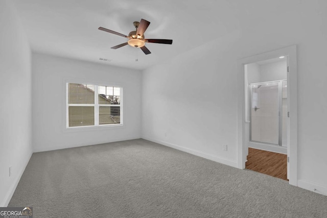 empty room with ceiling fan and carpet floors