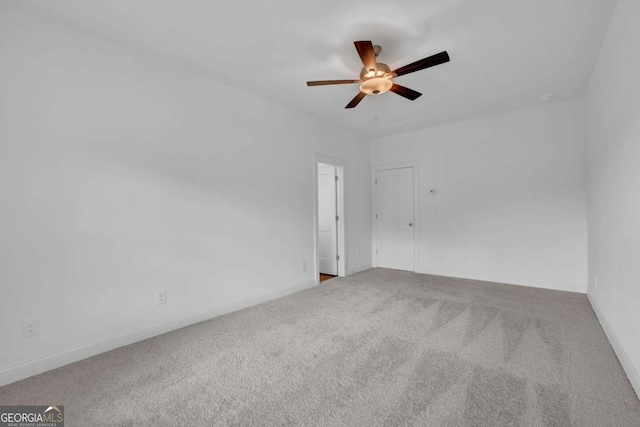 spare room with ceiling fan and carpet flooring