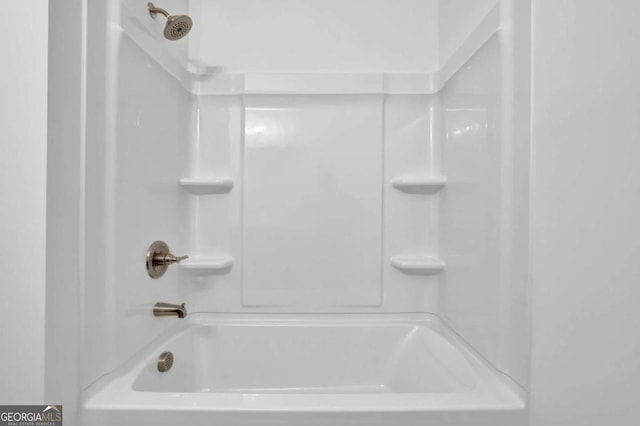 bathroom with shower / bath combination