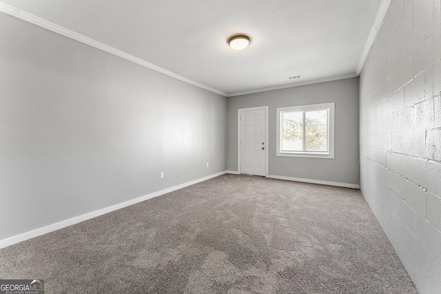 unfurnished room with carpet flooring and crown molding