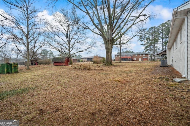 view of yard with central air condition unit