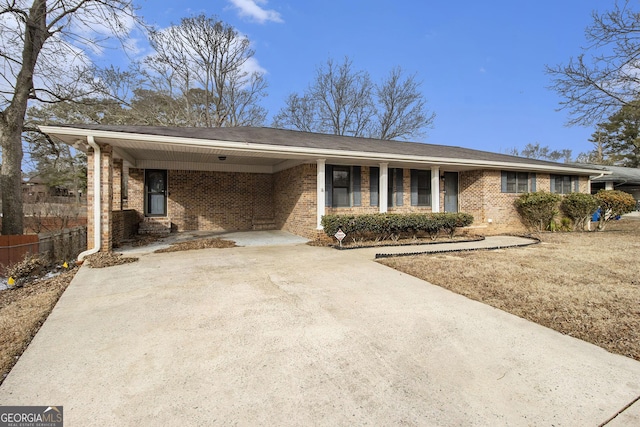 ranch-style house featuring a carport