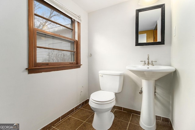 bathroom featuring tile patterned flooring and toilet