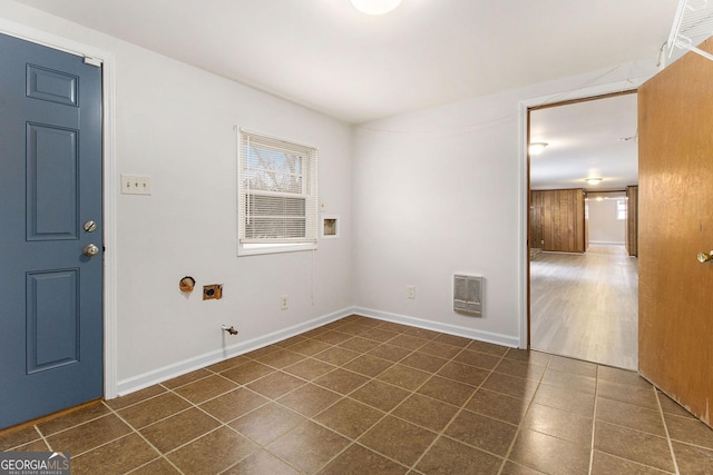 laundry area featuring washer hookup, heating unit, dark tile patterned flooring, hookup for a gas dryer, and hookup for an electric dryer