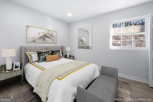 bedroom with wood-type flooring