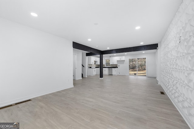 unfurnished living room with light hardwood / wood-style floors