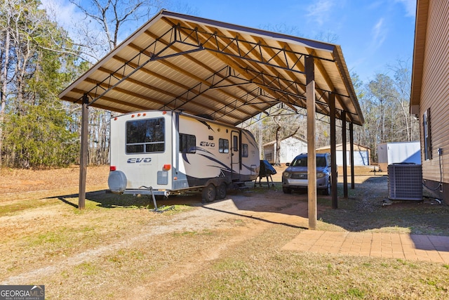 view of vehicle parking with a carport