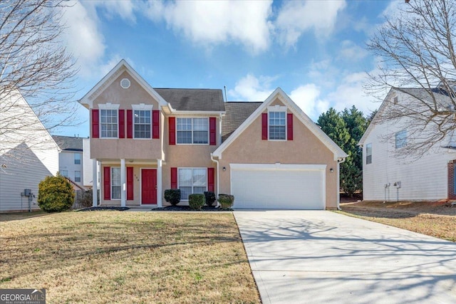 view of front facade featuring a front yard and a garage