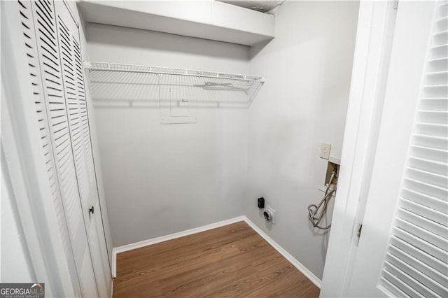 washroom with wood-type flooring, electric dryer hookup, and washer hookup