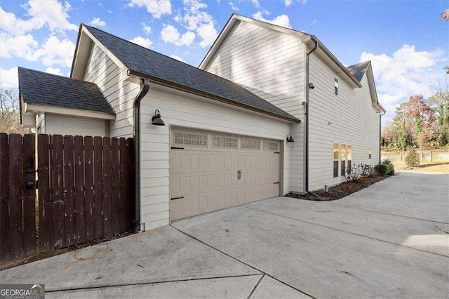 view of side of home with a garage