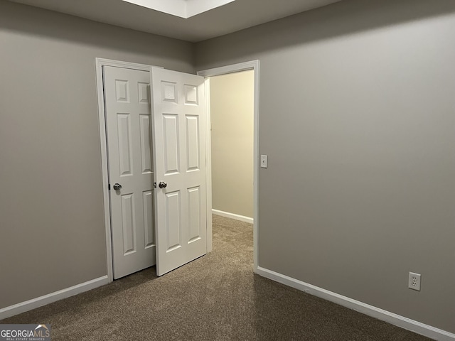 unfurnished bedroom featuring carpet floors