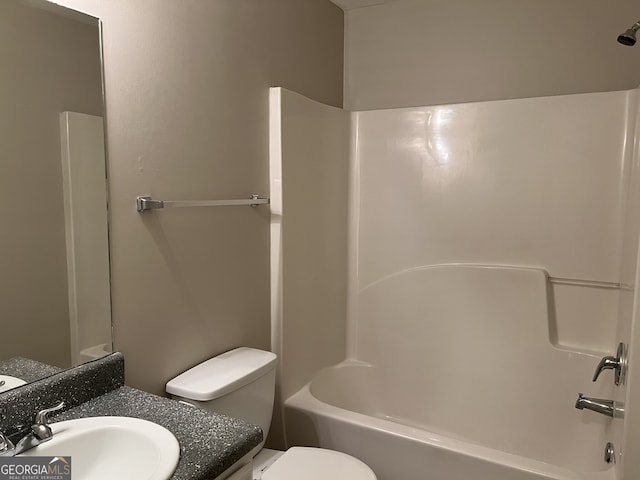 full bathroom with vanity,  shower combination, and toilet