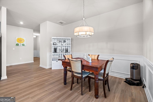 dining space featuring hardwood / wood-style flooring