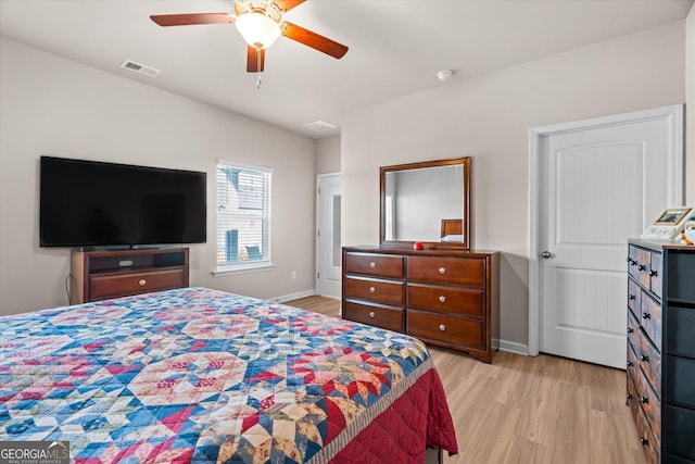 bedroom with light hardwood / wood-style flooring and ceiling fan