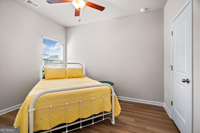 bedroom featuring dark wood-type flooring and ceiling fan