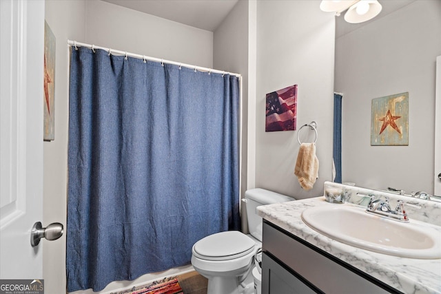 bathroom with vanity and toilet