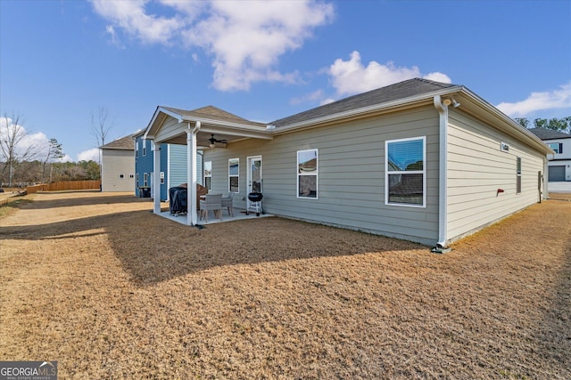 rear view of house with a patio and ceiling fan