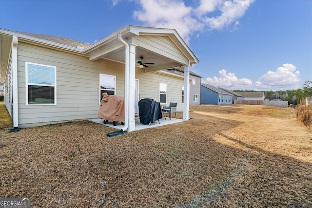 rear view of house with a patio and ceiling fan