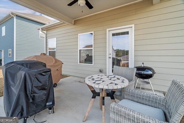 view of patio with area for grilling and ceiling fan