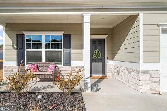 property entrance with a porch