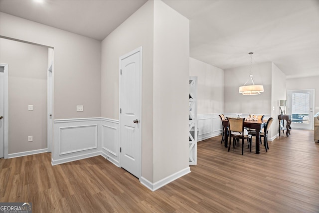 dining room with wood-type flooring