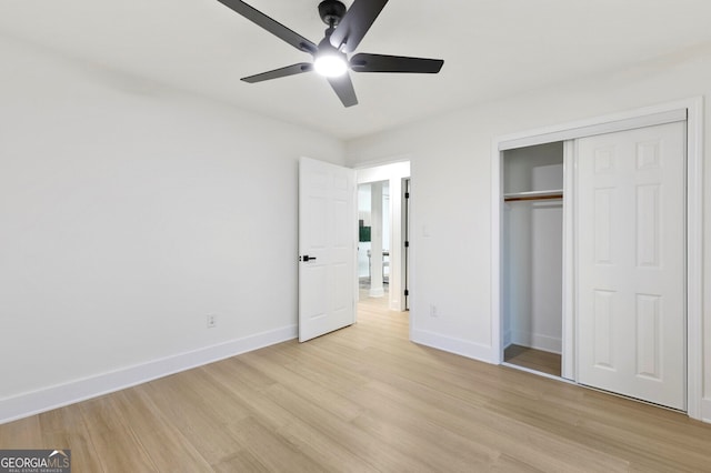 unfurnished bedroom featuring ceiling fan, light hardwood / wood-style floors, and a closet