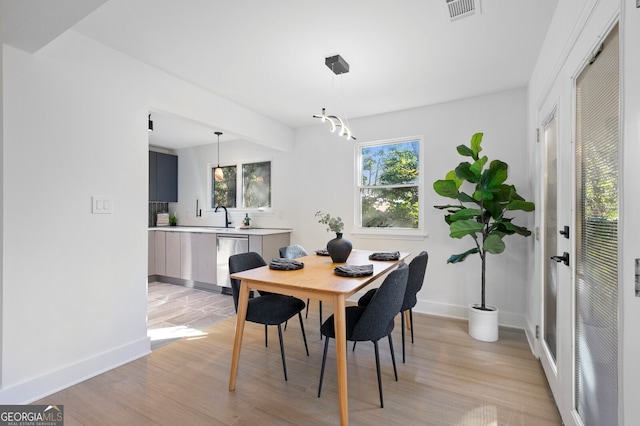 dining space with light wood-type flooring