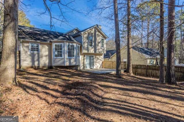 rear view of house featuring a patio