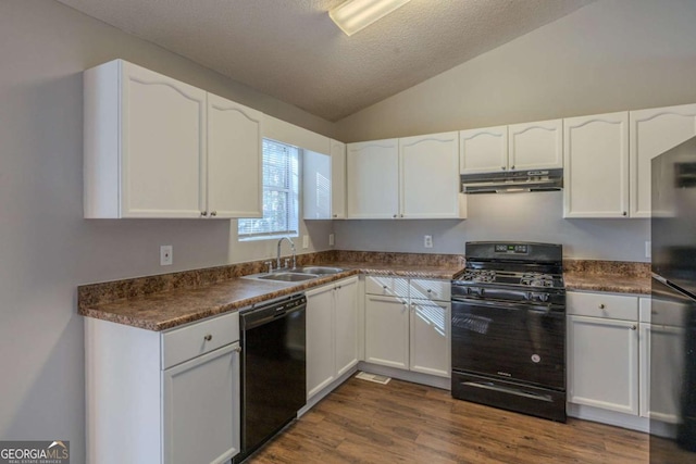 kitchen featuring vaulted ceiling, dark hardwood / wood-style flooring, sink, white cabinets, and black appliances